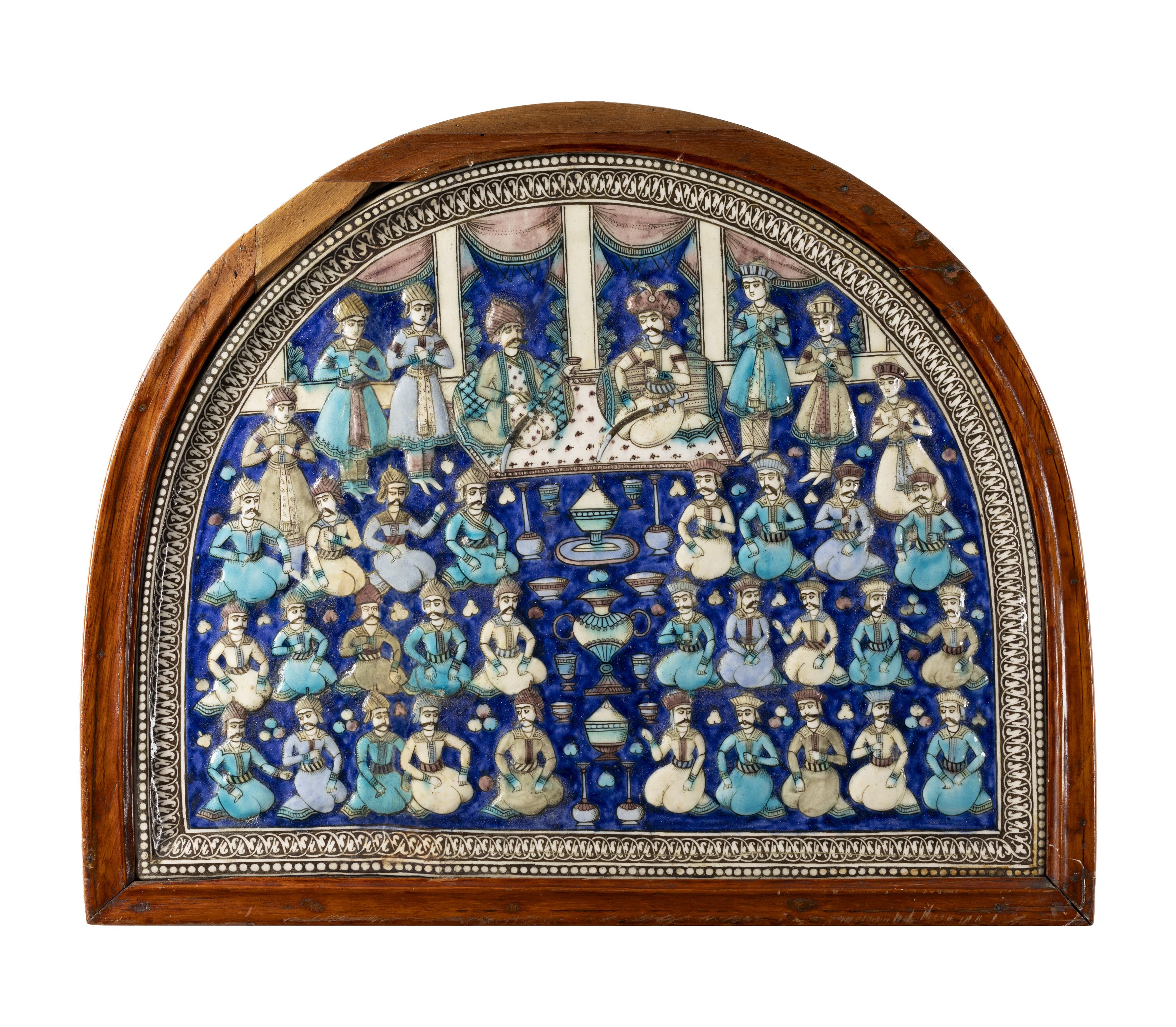 A large framed hemispherical moulded polychrome figural pottery tile, Tehran, Qajar Iran, c.1860,...
