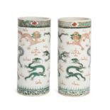 A pair of Chinese famille verte cylindrical vases, Late Qing dynasty, Finely enamelled with nine ...