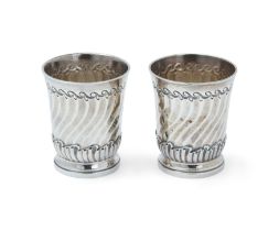 A pair of novelty miniature beakers, Stamped with French marks to bases, The spirally fluted bodi...