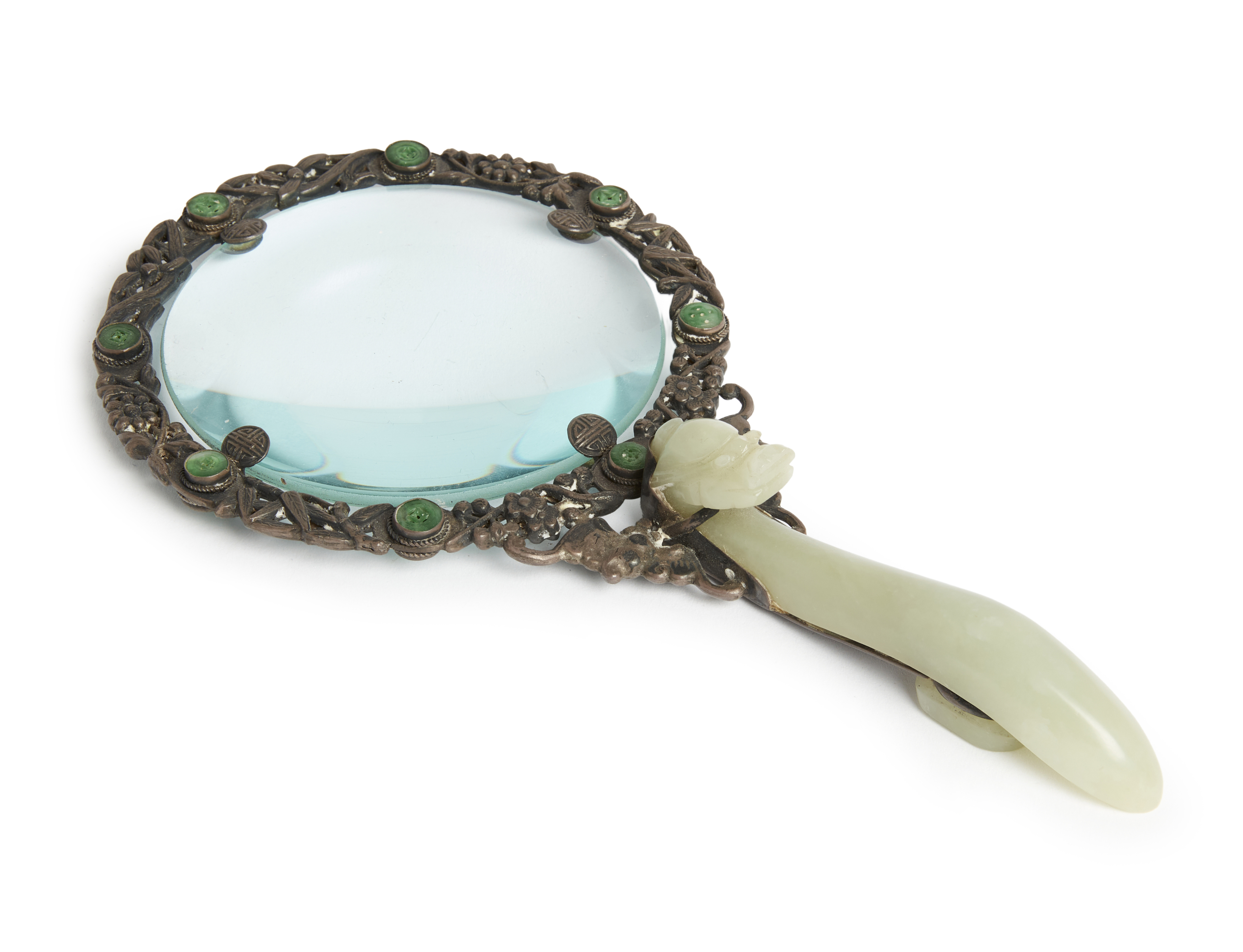 A Chinese magnifying glass with jade dragon belt hook handle and silver jade-inset rim, Late Qing...