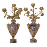 A pair of French gilt-bronze mounted amethyst three-light candelabra, Of Louis XVI style, mid-19t...