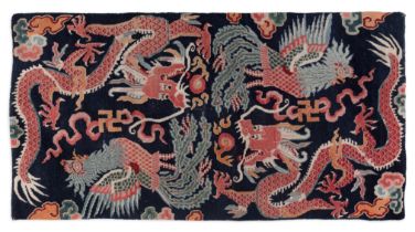 A Chinese wool carpet fragment, Last quarter 19th century, Decorated with two dragons and two pho...