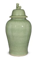 A large Chinese celadon-glazed jar and cover, Late 20th century, The baluster-form vessel and cov...