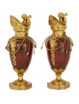 A pair of French gilt-bronze mounted rouge griotte marble ewers, Of Louis XVI style, mid-19th cen...