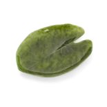 A Chinese spinach jade leaf form dish,  20th century, Carved as a lily pad, 20cm long