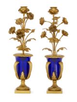 A pair of French gilt-bronze and cobalt blue glass candlesticks, Of Louis XVI style, late 19th ce...