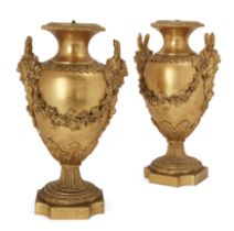 A pair of French gilt-bronze vases, Of Louis XVI style, late 19th century, Of ovoid outline with ...