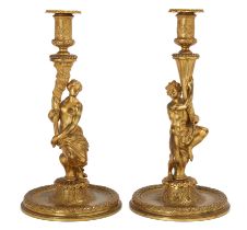 A pair of French gilt-bronze figural candlesticks, In the manner of Corneille van Cleve, late 19t...