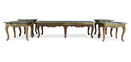 A suite of French walnut low tables, Three 18th century and two 19th century, With verde antico t...