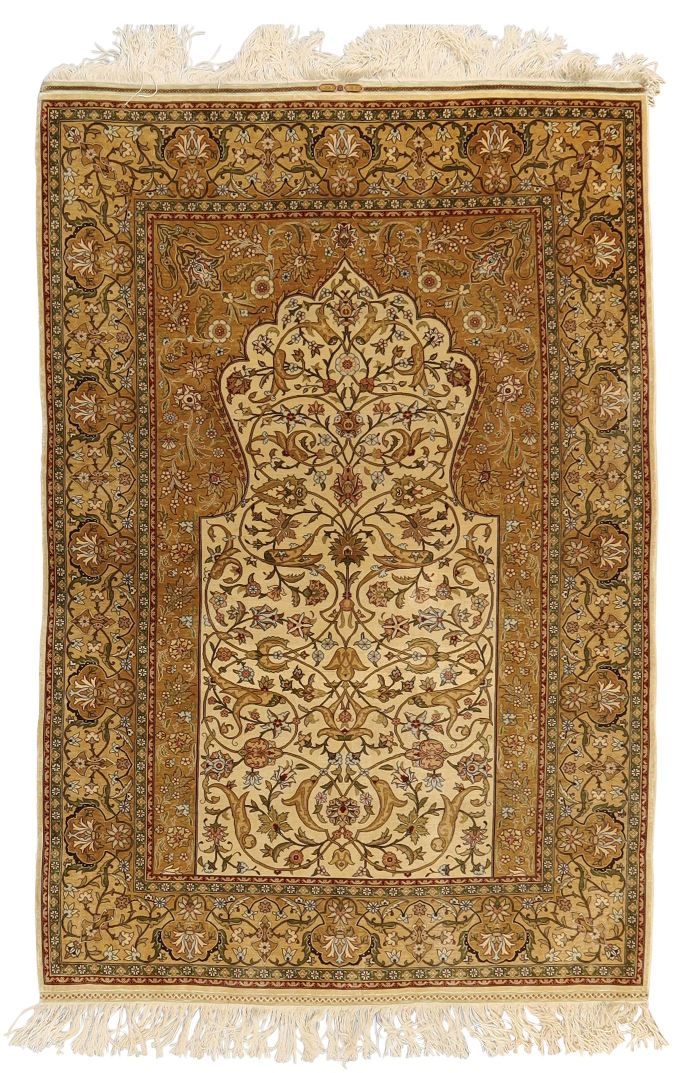 A Turkish silk Hereke prayer rug, Signed, third quarter 20th century,  The mihrab field with flor...