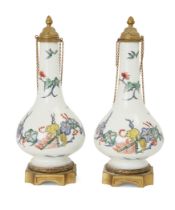 A pair of gilt-brass mounted Continental porcelain Kakiemon bottle-flasks and covers, 19th centur...