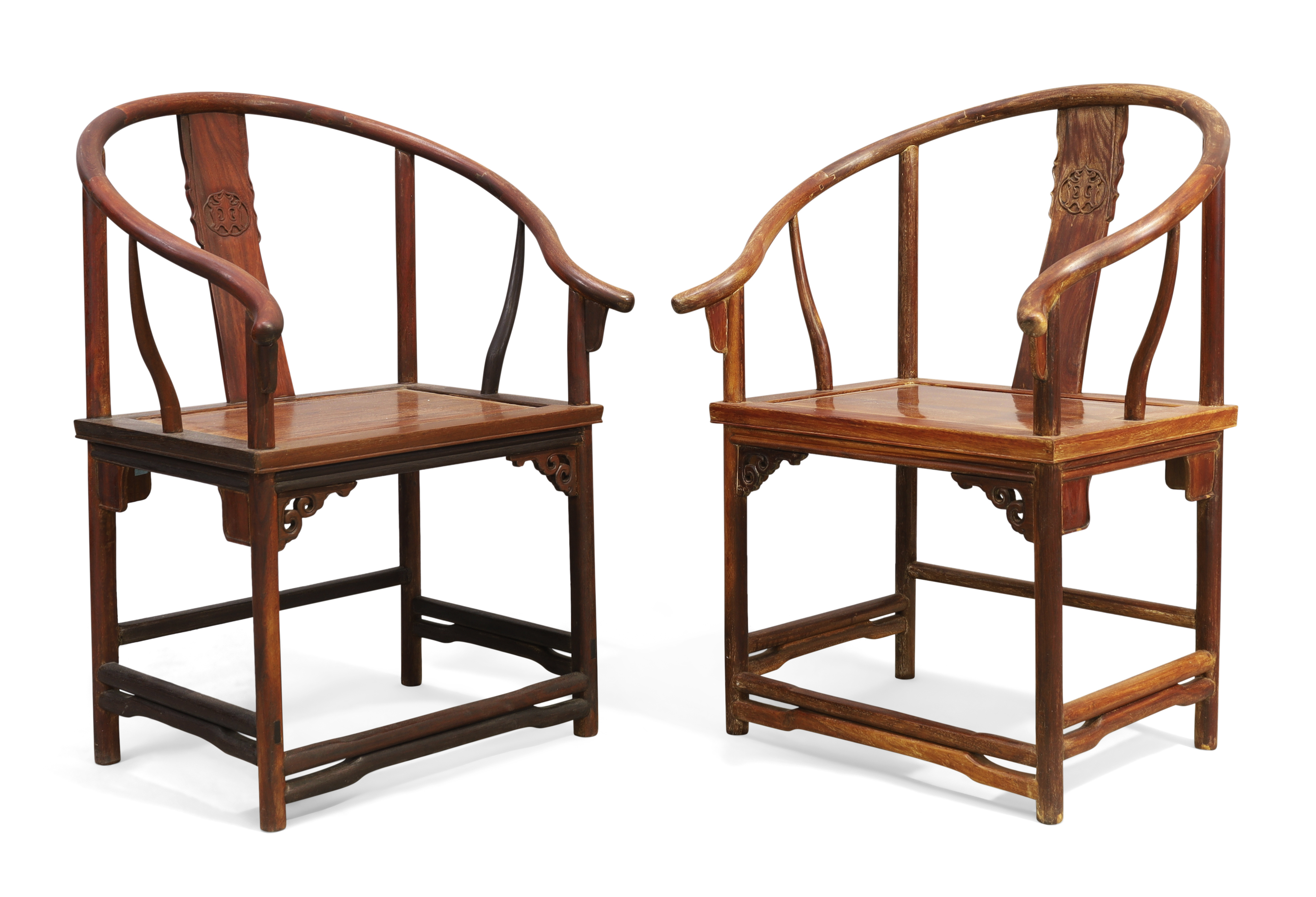 A pair of Chinese horseshoe backed armchairs, quanyi, Early 20th century, With central splat carv...