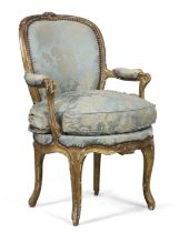 A Louis XV giltwood fauteuil, By Mathieu Bauve, third quarter 18th century, With carved floral cr...