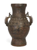 A large Chinese archaistic bronze vase, hu, Late 19th century, 62cm high