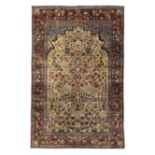 A Persian silk Kashan rug, First quarter 20th century,  The central field with vase of flower des...