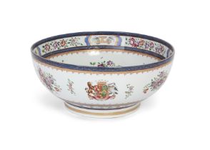 A French chinoiserie armorial punch bowl, Possibly Samson, mid-19th century, The heavily potted v...
