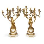 A pair of French gilt-bronze eight-light candelabra, In the manner of Clodion, third-quarter 19th...