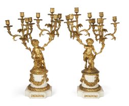 A pair of French gilt-bronze eight-light candelabra, In the manner of Clodion, third-quarter 19th...