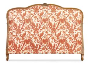 A French carved fruitwood headboard, Of Louis XV style, second half 20th century,  With matching ...