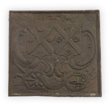 A large cast-iron fire-back, Late 19th / 20th century, With central armorial shield flanked by sc...