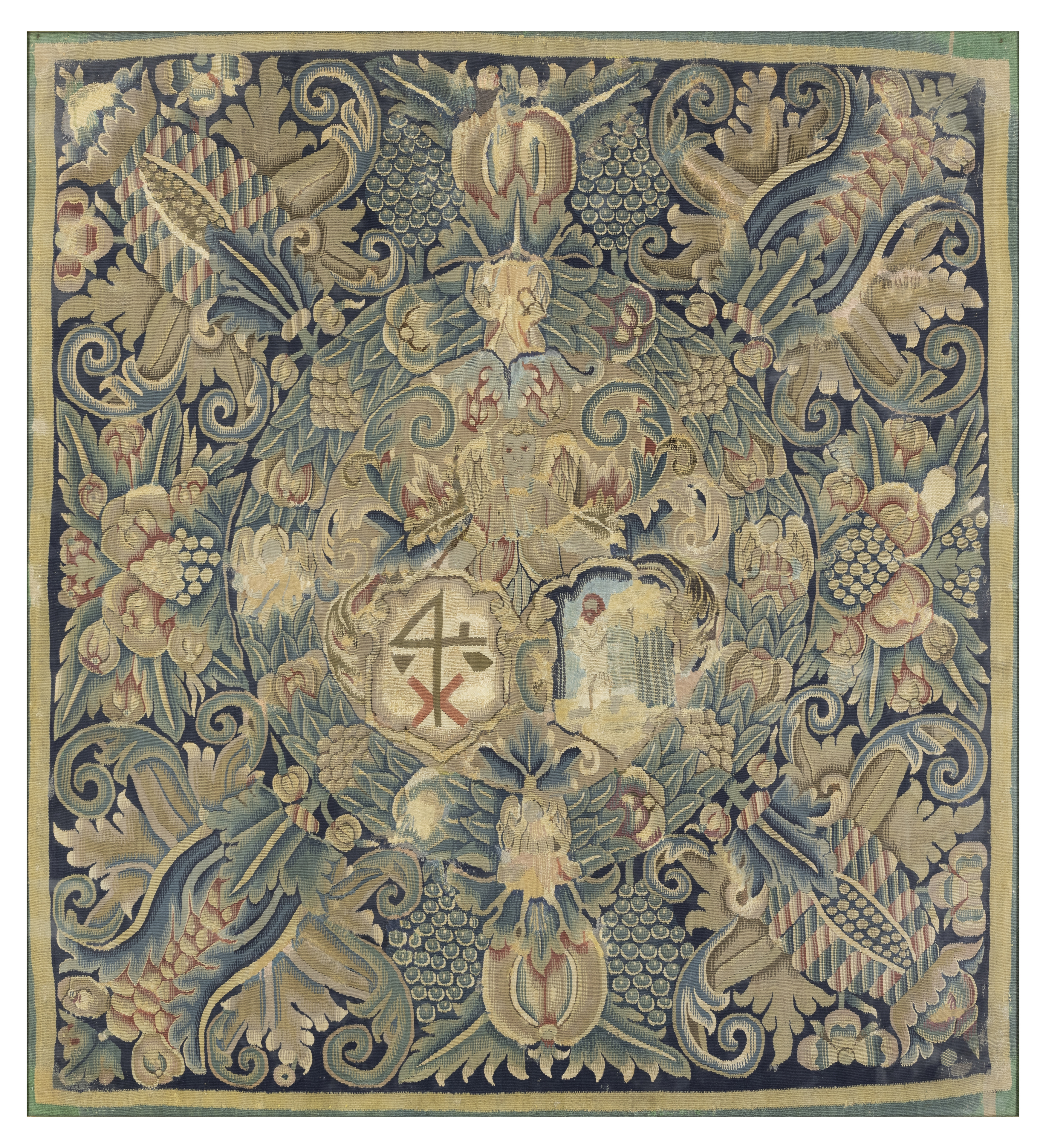 A North German armorial tapestry panel,  Mid-17th century,  Woven in wools and silks, with an ang...
