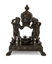A Paduan bronze inkwell, 16th century, With four infants supporting a lidded vase, on a square se...