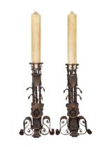 A pair of Spanish wrought-iron floor-standing andiron/candlesticks, Of Gothic style, 19th century...