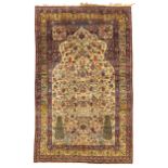 A Persian silk Kirman rug,  Third quarter 19th century, The central field with stylised tree desi...