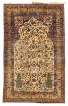 A Persian silk Kirman rug,  Third quarter 19th century, The central field with stylised tree desi...
