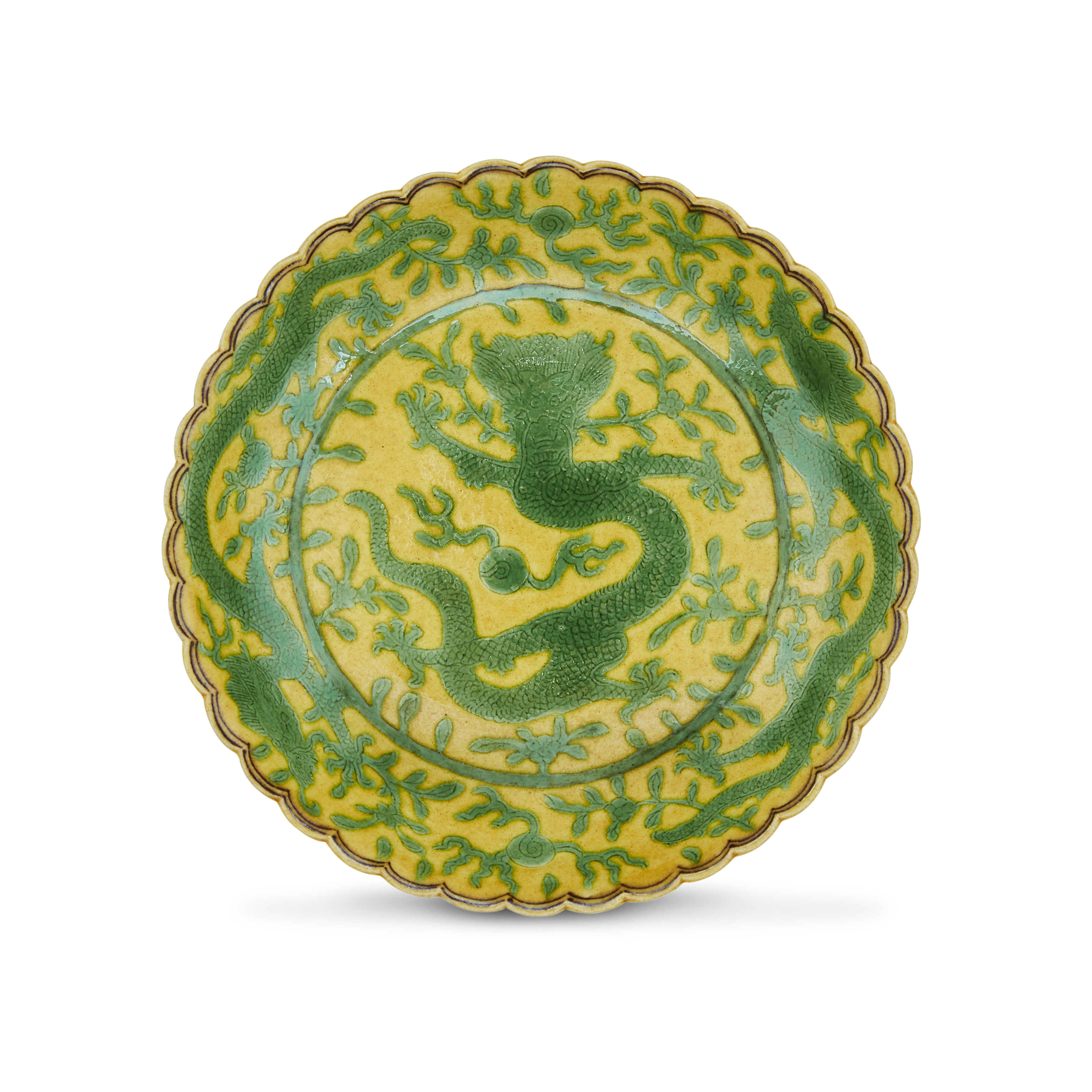 A small Chinese incised yellow ground green 'dragon' foliate dish Qing dynasty, Daoguang mark an...