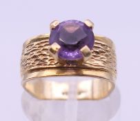 A 1970's style 9 ct gold amethyst ring. Ring size G/H. 4.4 grammes total weight.