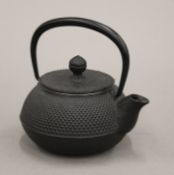 A modern Japanese cast iron teapot. 12.5 cm long.