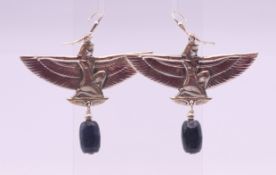 A pair of sterling silver Egyptian Revival earrings. 5 cm wide.
