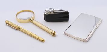 A boxed Calibri pen and magnifying glass set, a boxed Ronson lighter and a card case.