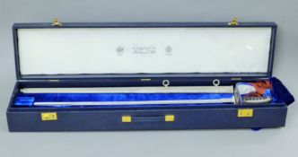 A boxed Wilkinson Sword Queen Mother Centenary sword. The sword 97 cm long.