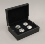 A Royal Mint Tower of London 5 pound silver proof coin set.