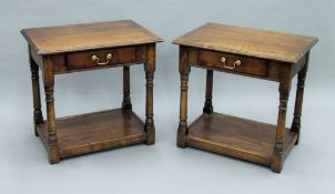 A pair of oak side tables each with dummy drawer. Each 63 cm wide.