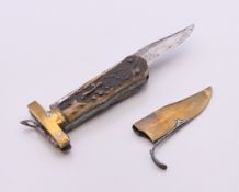 A 19th century antler handled folding knife with brass tip cover. 22 cm long open.