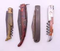 Four various folding knives. The largest 13 cm long closed.