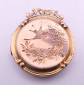 A 9 ct gold locket. 2.75 cm high. 4.4 grammes total weight.