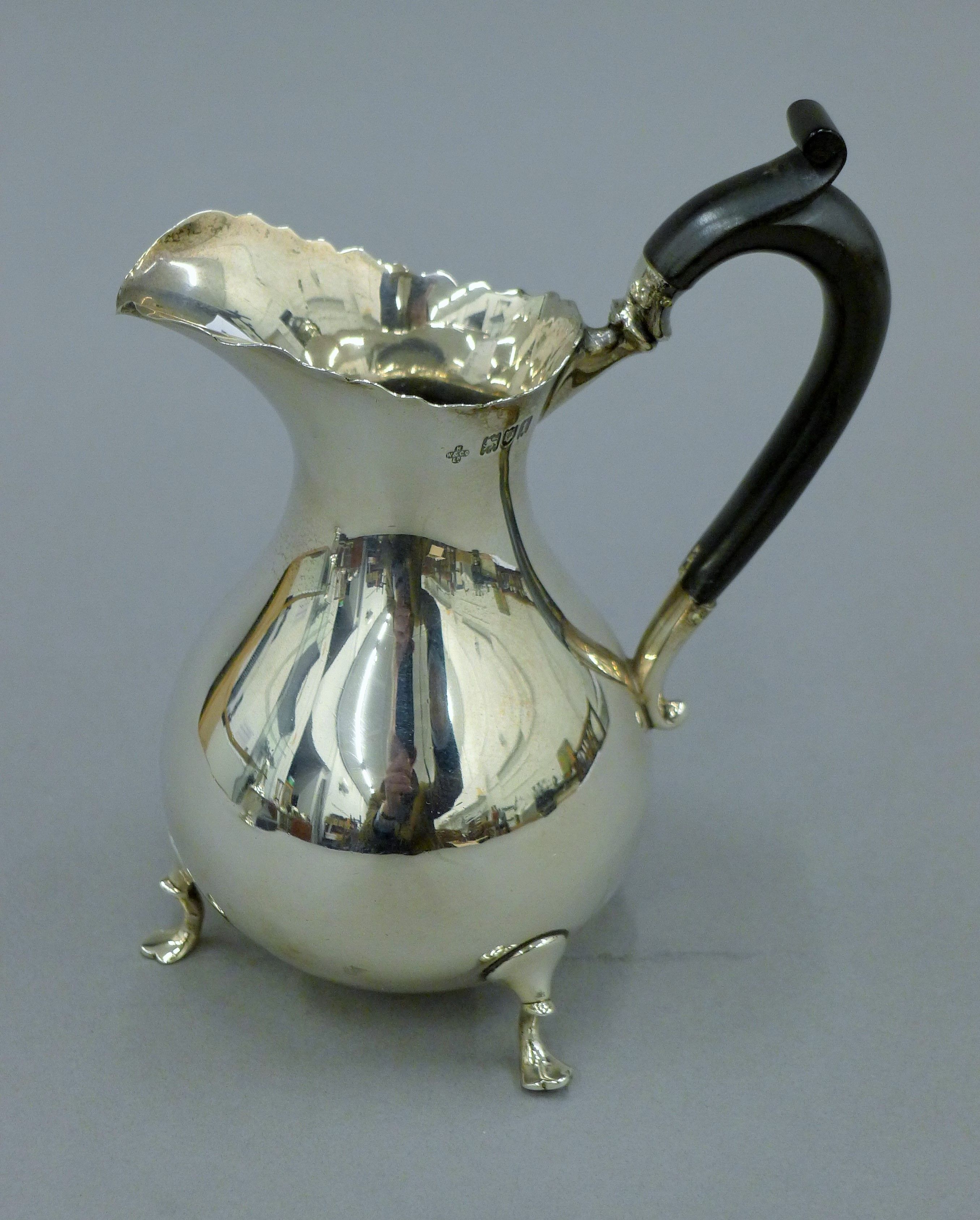 A large silver cream jug. 16.5 cm high. 270.6 grammes total weight.