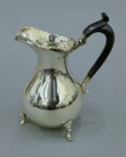 A large silver cream jug. 16.5 cm high. 270.6 grammes total weight.