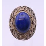 A silver filigree and lapis ring. Ring size K/L.