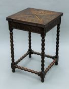 A Victorian carved oak envelope card table. 48.5 cm wide.