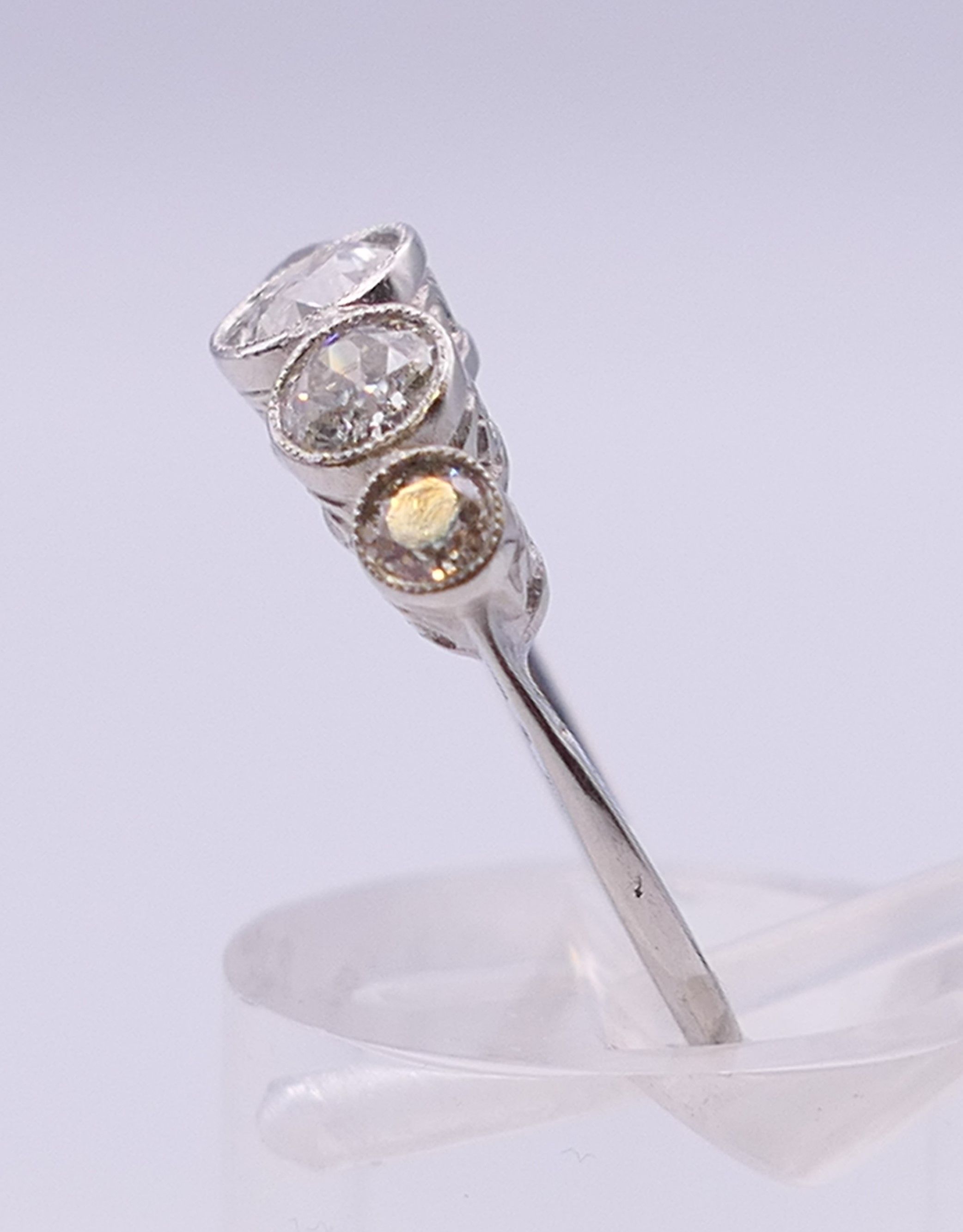 A platinum five stone diamond ring. Ring size N/O. - Image 4 of 6