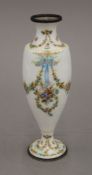 A 19th century enamel vase decorated with trailing floral swags. 20 cm high.