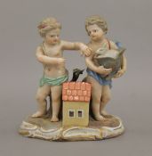 A Meissen porcelain figural group formed as two putto with a rabbit. 11 cm high.
