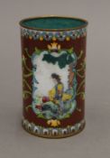 A cloisonne brush pot decorated with a figural vignette with opposing scenic vignette. 12.5 cm high.