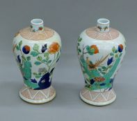 A pair of Republic Period Chinese porcelain polychrome decorated bottle vases. 24 cm high.