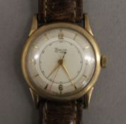 A 9 ct gold Timor wristwatch. 3 cm wide.